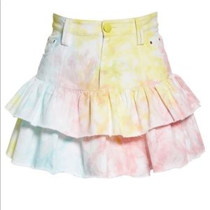 Love shack fancy mini skirt with bright tie-dye and ruffled hem. Me